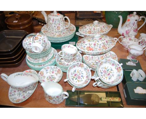 A Mintons part tea and dinner service in the Haddon Hall pattern to include boxed napkin rings and cake slice etc. Most piece