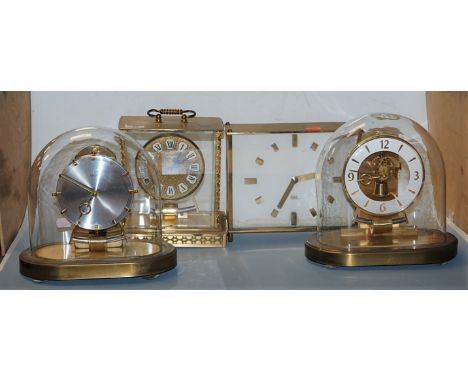 A Kundo electronic brass cased mantel clock together with three others (4)