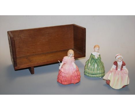 Three small Royal Doulton figurines to include Rose HN1368, Dinky Dough HN2120, and Belle HN2340, mounted on a small Edwardia