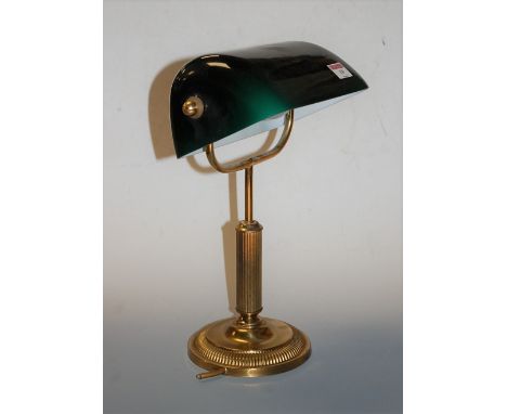 A lacquered brass desk lamp, with adjustable green glass shade