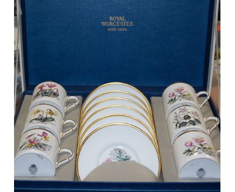 A boxed set of six Royal Worcester coffee cans and saucers, having printed mark verso and numbered 22791; together with one o