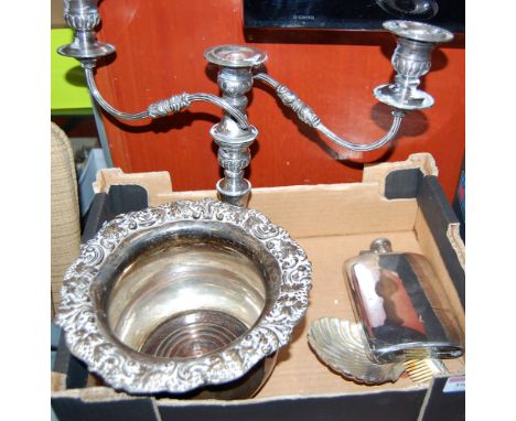 A 19th century silver plated bottle coaster, having a leaf cast rim and mahogany base; together with a silver plated candelab