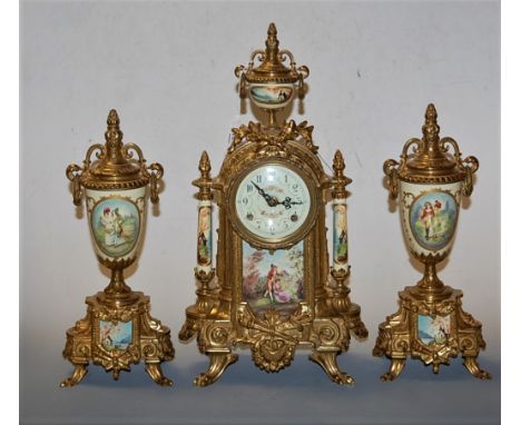 A German gilt metal cased and porcelain inset three piece mantel clock garniture having an enamel dial with Arabic numerals a