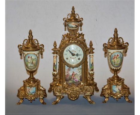 A German gilt metal cased and porcelain inset three piece mantel clock garniture having an enamel dial with Arabic numerals a