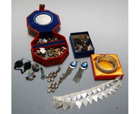 A box of miscellaneous costume jewellery to include enamelled stick pin, white metal drop pendant earrings, various bangles, 