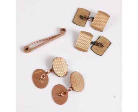 A pair of oval 9ct cufflinks with engine turned engraved decoration, (4.6g), together with a 9ct tie pin (2.2g) and a pair of