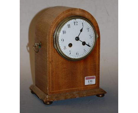 An Edwardian mahogany and boxwood strung dome top mantel clock having a convex enamel dial with Arabic numerals and eight day