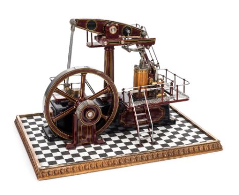 *Beam Engine. A fine scratch built model of a beam engine,  the cylinder with brass bound mahogany cladding, spoked flywheel,