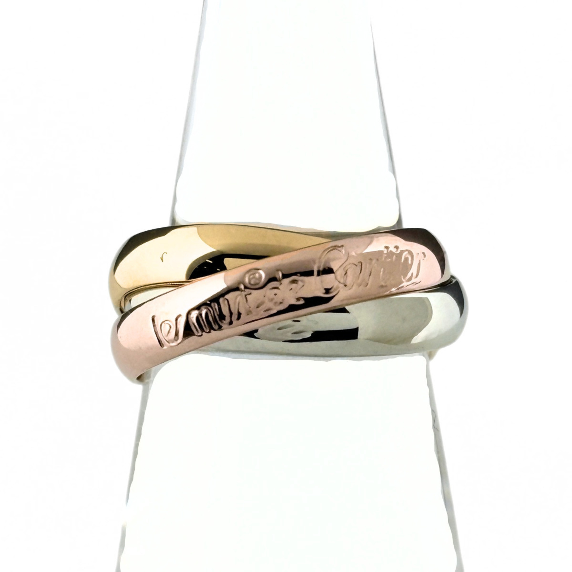 Cartier Trinity Ring, available in yellow gold (YG), pink (PG), and white (WG). Three-color design,