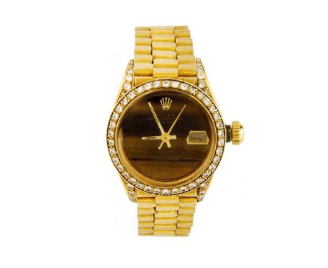 Lady's Vintage Rolex 18 Karat Yellow Gold Presidential Date-Just Bracelet Watch with Tiger Eye Dial and Diamond Bezel, with B