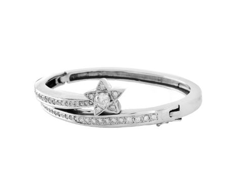 Vintage Round Brilliant Cut Diamond and 14 Karat White Gold "Shooting Star" Bangle Bracelet. Stamped 14K. Measures 5/8" W, 2-