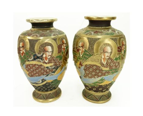 Pair of Japanese Satsuma Moriage Pottery Vases. Signed to base. Measures 12-1/4" H x 6-1/2" W. Condition: Crazing, light rubb