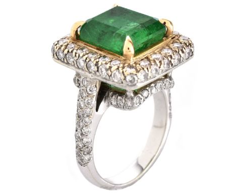 GIA Certified 5.32 Carat Step Cut Emerald, Pave Set Full Cut Round Brilliant Cut Diamond and 14 Karat White and Yellow Gold. 