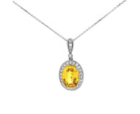 Approx. 6.50 Carat Oval Cut Yellow Sapphire, .65 Carat Round Brilliant Cut Diamond and 18 Karat White Gold Pendant with 14 Ka