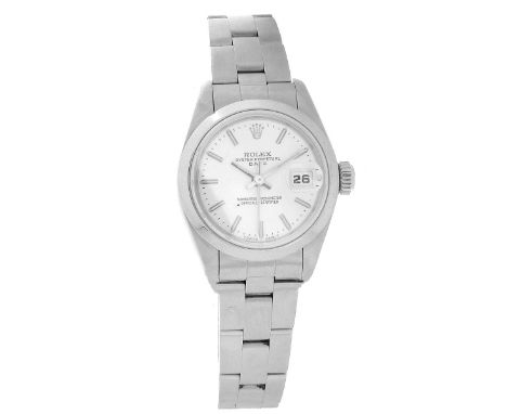 Rolex Lady's Datejust Oyster Perpetual Watch. Stainless steel, self winding. Warranty card included. Signed. Case measures 26