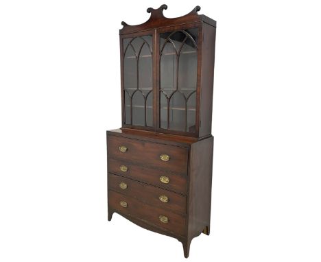 Regency inlaid mahogany secretaire-bookcase, the scrolled pediment decorated with moulded roundels, over two astragal glazed 
