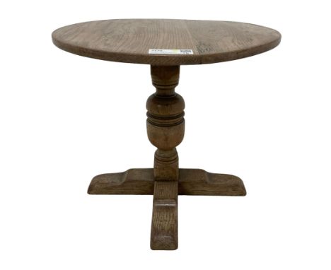 Small Arts & Crafts oak occasional table, circular top on turned baluster pedestal with cruciform sledge feetDimensions: Heig