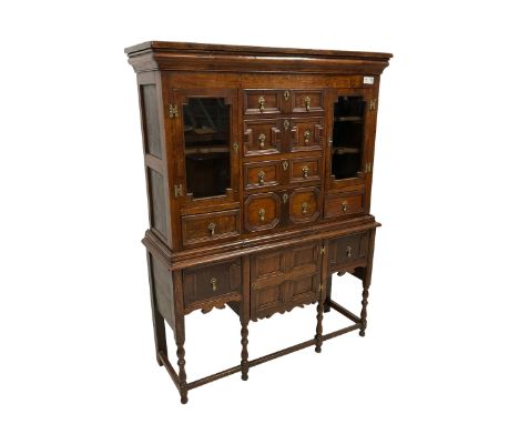 17th century design oak chest on stand, projecting ogee cornice over six drawers and two flanking glazed cupboards with step 