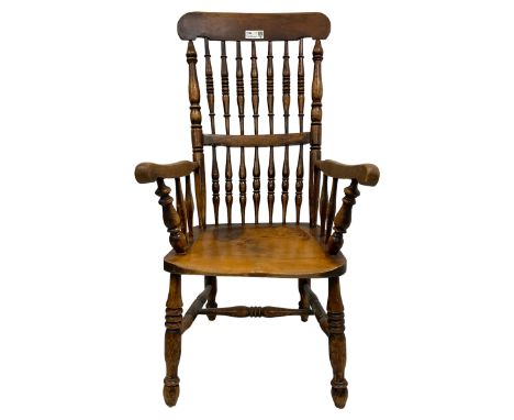 19th century elm and beech spindle back armchair, shaped bar back over two rows of turned spindles, dished seat on turned sup