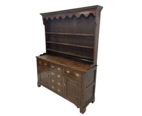 19th century Georgian design oak dresser, projecting cornice over shaped apron and three-tier plate rack, the base fitted wit