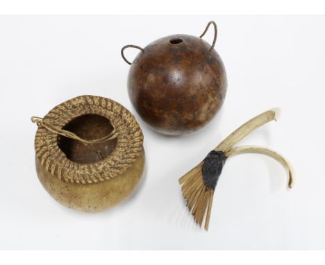 Boar tusk comb, 14cm and two Papa New Guinea gourds (3) 