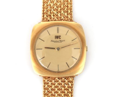 An 18 karat gold gentleman's wristwatch by IWC, ca. 1960's. Mechanical movement. TV case, round champagne coloured dial, bato