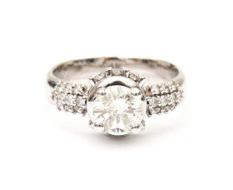 An 18 karat white gold diamond solitaire ring set with a  brilliant cut diamond of ca.  1.40 ct. ca. J-K, PIQ3. The shank is 