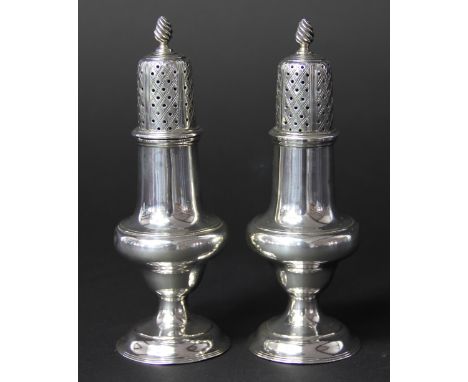 A pair of silver pepperettes C. Shapland & Co, London 1930, each of baluster form, with flame finial, 14cm high, total weight