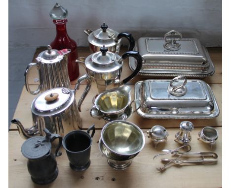 A selection of silver plated wares, to include; entree dishes, a condiment set, sugar nips, EPNS tea and coffee wares, a red 
