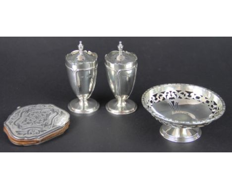 A pair of silver pepperettes, Mappin and Webb, Birmingham 1908, each of pedestal urn shape and similar finial, 9cm high; a si