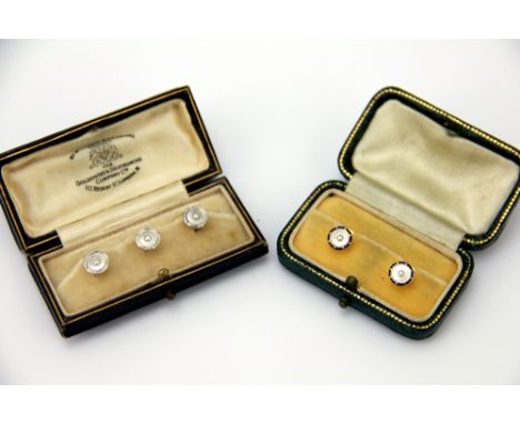 A cased set of three shirt studs, Goldsmiths & Silversmiths, each designed as a other of pearl panel centred by a seed pearl 