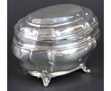 A silver tea caddy Charles Stuart Harris, London 1901, of bombe form and raised on four bracket feet, 9cm high, weight 7.5ozt