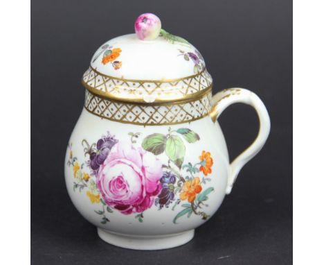 An 18th century Hochst porcelain custard cup and cover, with bud finial, painted with a floral bouquet under a gilt cross hat