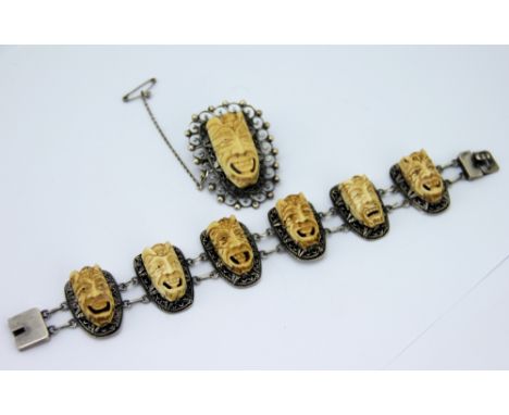 An Oriental silver and bone set bracelet and brooch, the bracelet designed as six links, each set with a carved bone masks, w