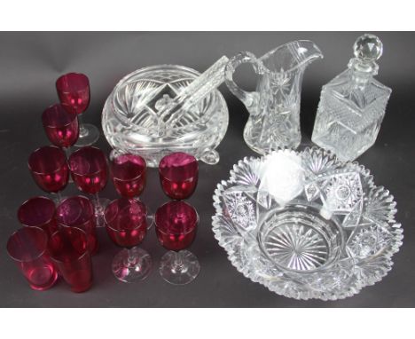 A cut glass circular bowl, 27cm diameter, a clear glass circular bowl on scroll feet 22cm high with glass servers, a glass ju