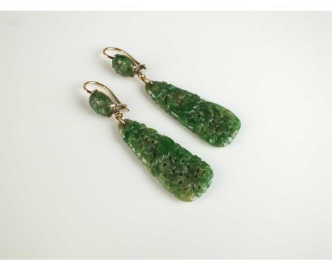 A pair of Chinese jadeite ear pendants, each designed as a decorative pieced and carved jadeite plaque depicting a bird among