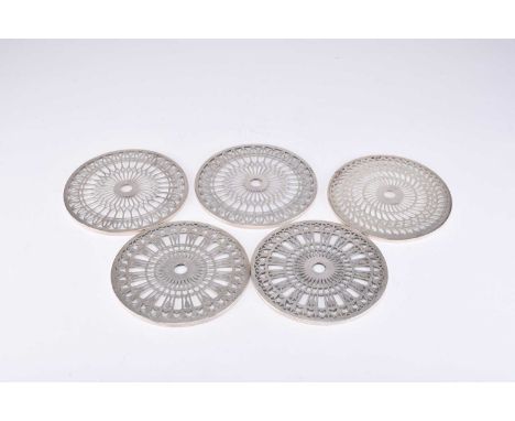 A collection of five silver mounted glass coasters, comprising; a pair with stylised tulip decoration, Mappin &amp; Webb, Bir