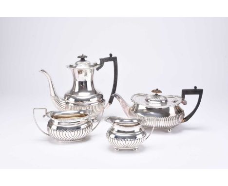 A matched four piece silver tea and coffee service, each piece of oval half reeded form, comprising; a Victorian teapot, Will