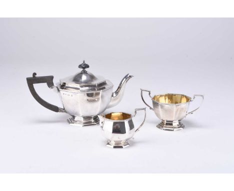 An Edwardian three piece silver tea service, William Aitken, Birmingham 1905, each piece of octagonal form, comprising; a tea