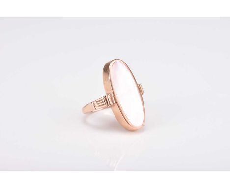 A 9ct gold mother of pearl ring, the elongated oval mother of pearl plaque mounted in 9ct gold, ring size R, weight approx 8g