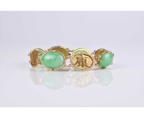 A Chinese yellow metal and jadeite panel bracelet, with integral push clasp, stamped '18k', 18.5cm long, weight approx 21.9gC