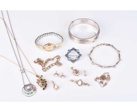 A yellow metal gold flat curb link bracelet, stamped '9kt', together with a 9ct gold sapphire pendant on chain, a 9ct gold op