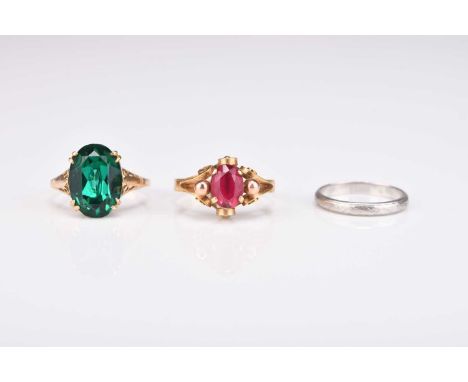 A white metal wedding band, stamped 'Platinum', size K 1/2, weight approx 2.6g, together with a synthetic ruby ring, the yell