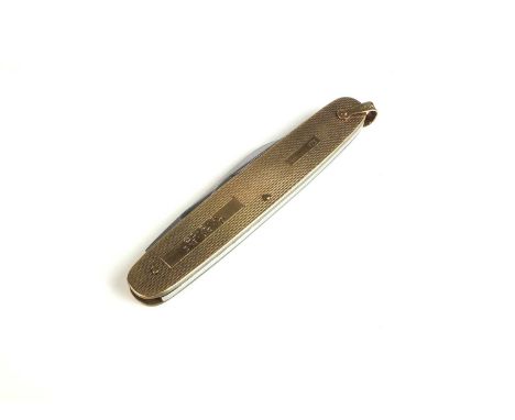 A 9ct gold mounted folding knife, with engine turned decoration, engraved 'J.N.M. 6.3.73', hallmarked S J Rose &amp; Son, Bir