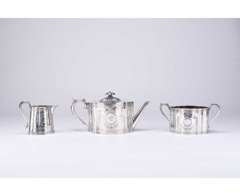 A Victorian matched three piece silver tea service, comprising; a teapot with ivory spacers to the handle and a two handled s