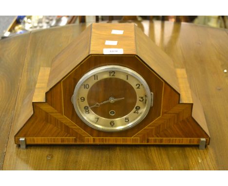 An Art Deco Westminster chime mantel clock, the dial with Arabic numerals, three winding holes, the case with radiating burst