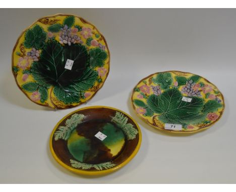 A pair of Wedgwood majolica strawberry plates, c.1910;  a Spode majolica jardiniere stand (3)
