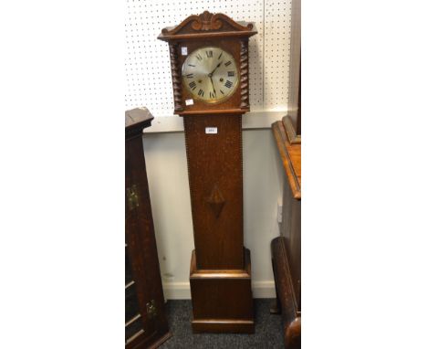 A mid-20th Century oak miniature longcase clock, Roman numerals, three winding holes, c.1930