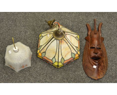 Lighting - a Tiffany-style marbled perspex ceiling light; another glass light shade; a contemporary tribal wood carving (3)