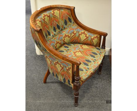 A late 19th Century mahogany tub chair button back in seat in liberty upholstery turned legs (1)